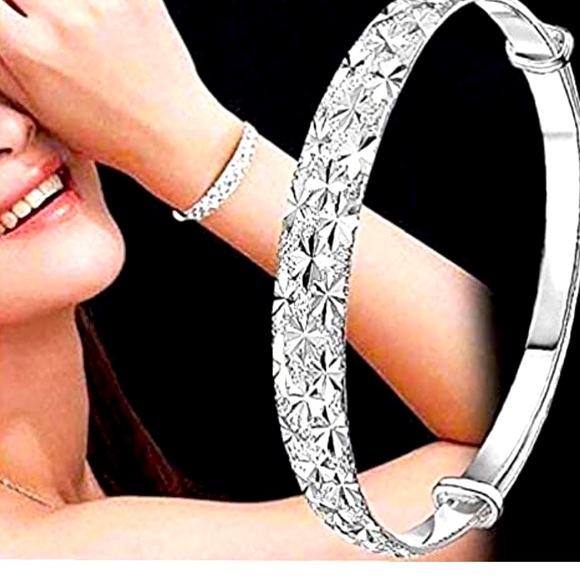 Jewelry - Sterling silver bangle with Diamond metal work cut outs.